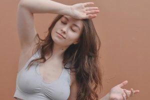A woman wearing a gray bra