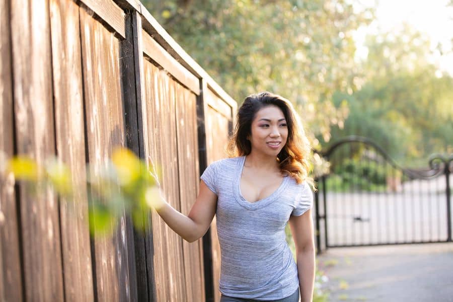 Woman wearing a gray v-neck shirt