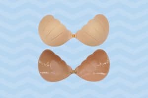 Front and back view of a brown sticky bra with clasp placed on a blue background