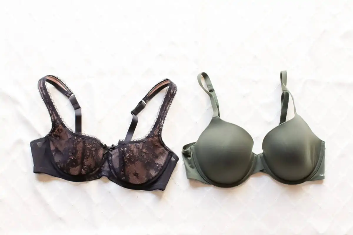 A black demi bra with lace and an underwire and a green full-coverage underwire bra