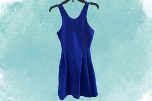 A blue strapless bodycon dress hangs on a black hanger