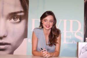 Miranda Kerr holding a sharpie at a fan signing event