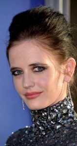 Eva Green wearing a bedazzled gown with a high neck and long sleeves at a movie premiere