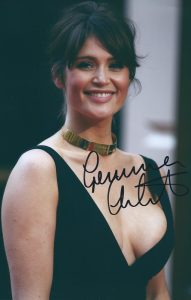 Gemma Arterton wearing a black deep v-neck dress at an award show