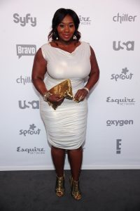 Bevy Smith wearing a white bodycon dress for the 2015 NBC Universal Cable Entertainment Upfront