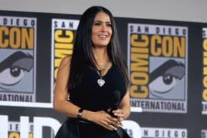 Salma Hayek wearing a blue ribbed tank top and black leather skirt for her SDCC appearance