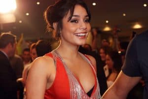 Vanessa Hudgens wearing a plunging red dress with silver necklace