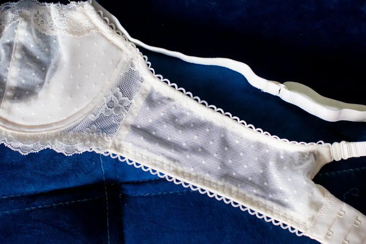 A balconette bra on a blue background