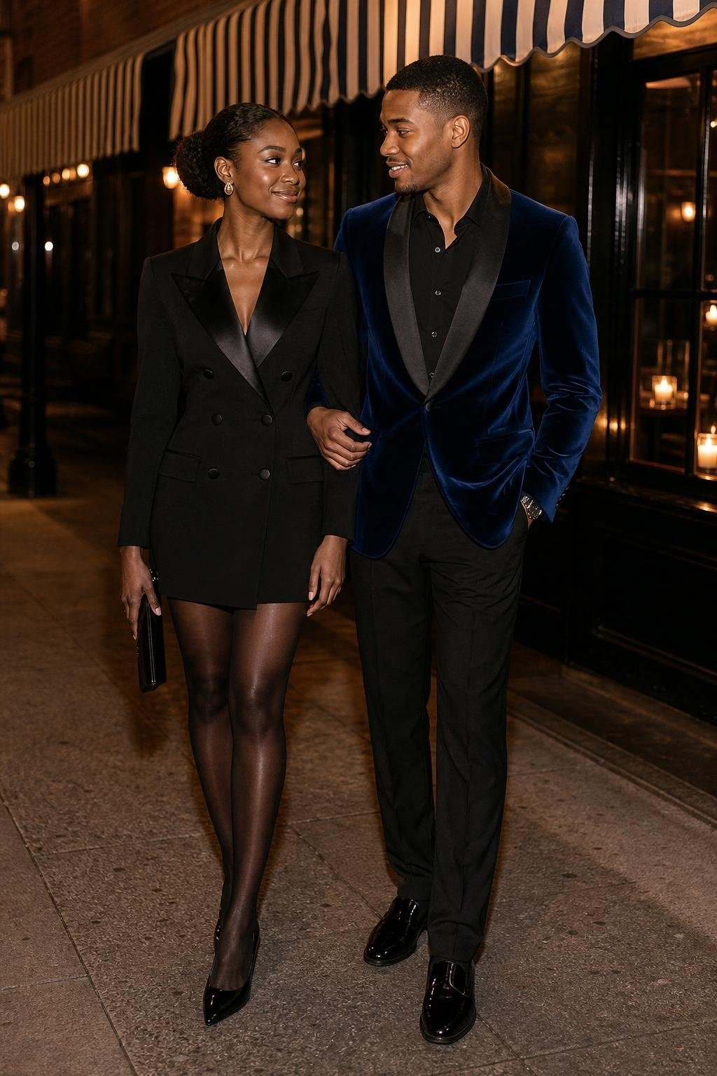 Black blazer dress with sheer tights and patent heels outside a candlelit cocktail bar (option 1)