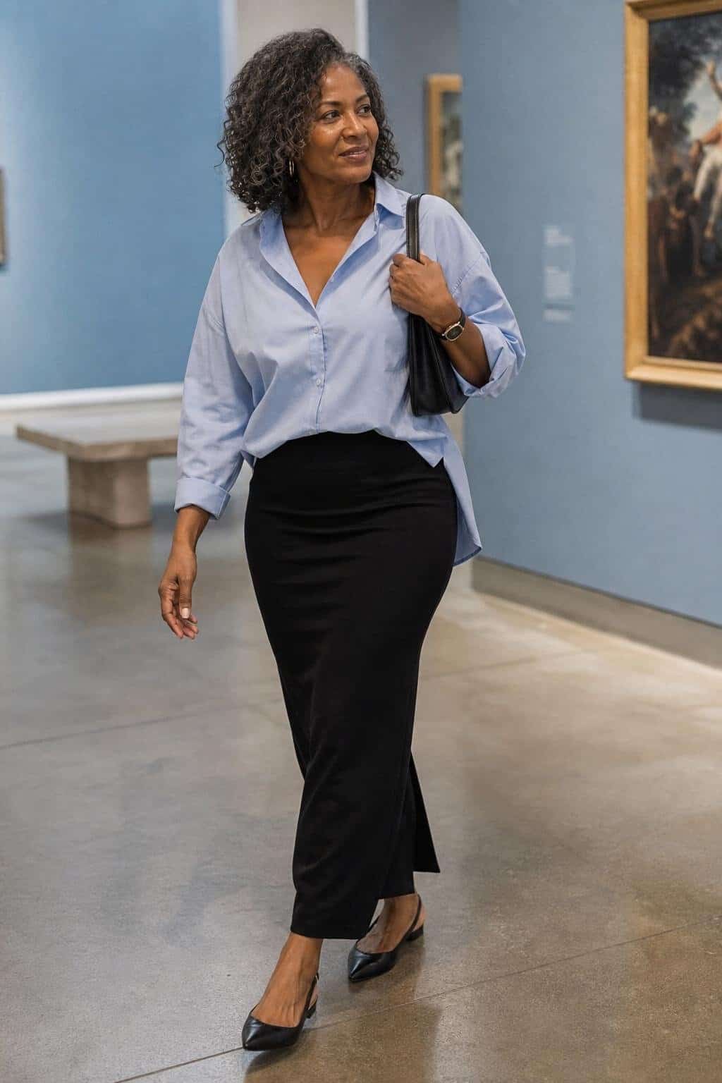 Black column skirt, pale blue relaxed button-down, slingback flats, leather shoulder bag, weekday museum visit (option 2)