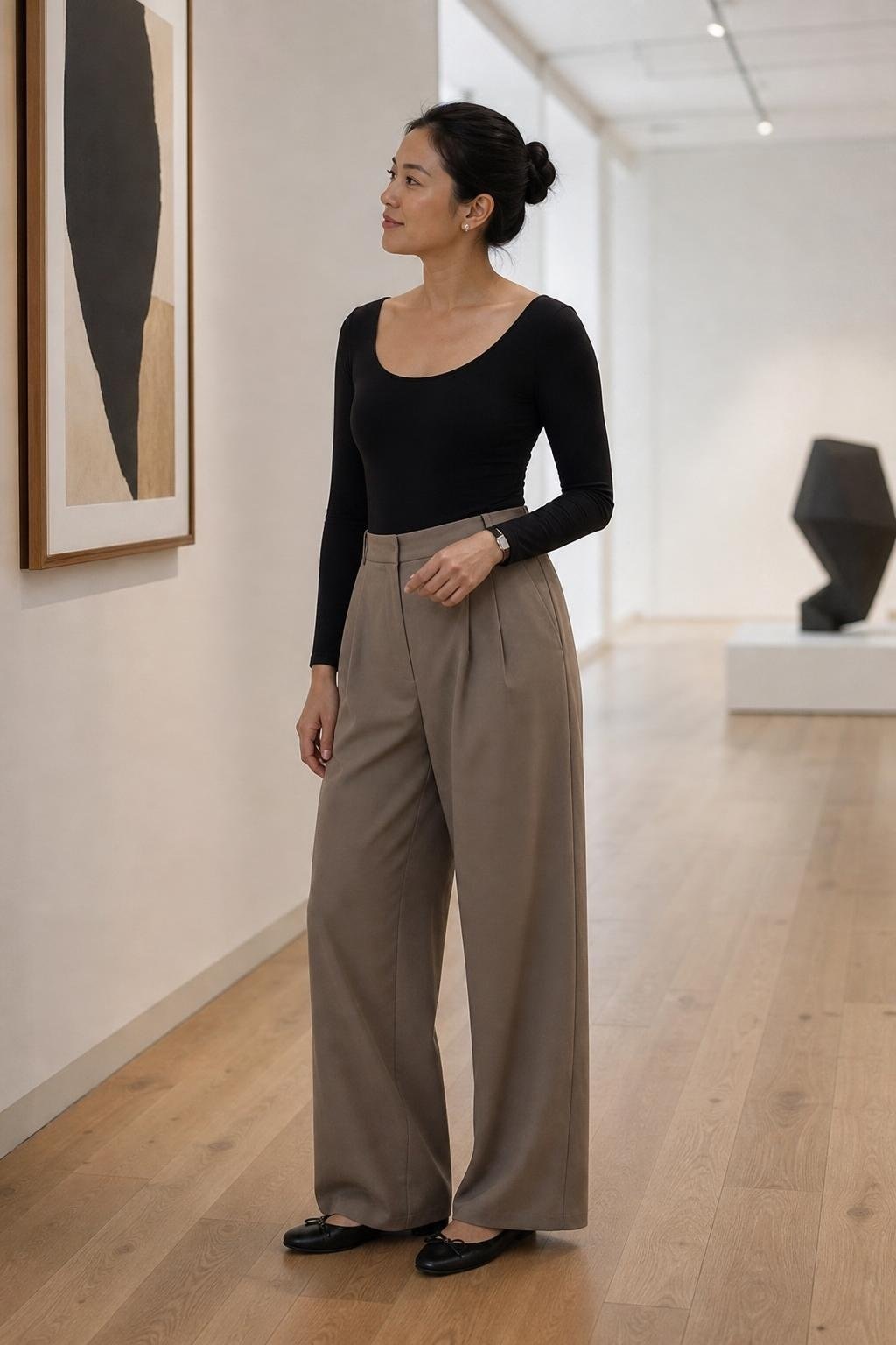 black leotard-style top, taupe wide-leg trousers, black flats, sleek bun, gallery afternoon (option 1)