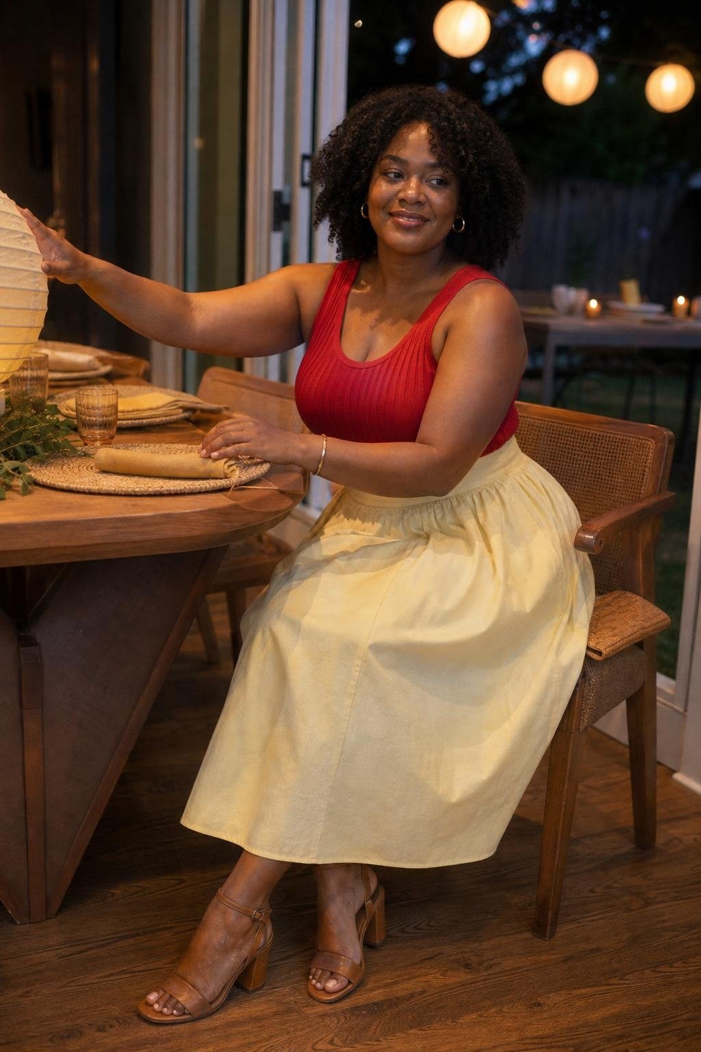 Butter yellow cotton midi skirt, red knit sleeveless top, tan block-heel sandals, backyard dinner with paper lanterns (option 2)