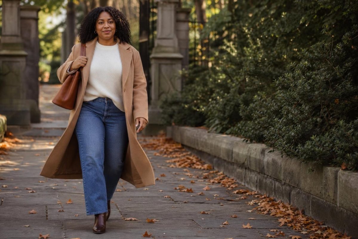 Camel coat, cream sweater, straight jeans, ankle boots, leather tote, leafy sidewalk morning (option 1)