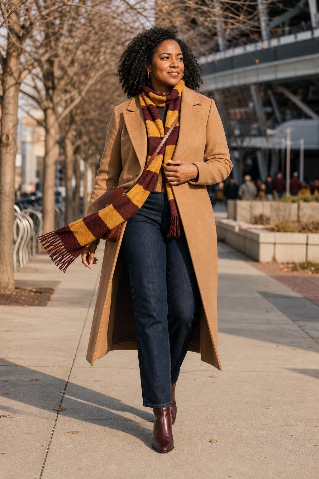 Camel wool coat, striped team scarf, dark denim, burgundy ankle boots, crisp city stadium approach (option 2)