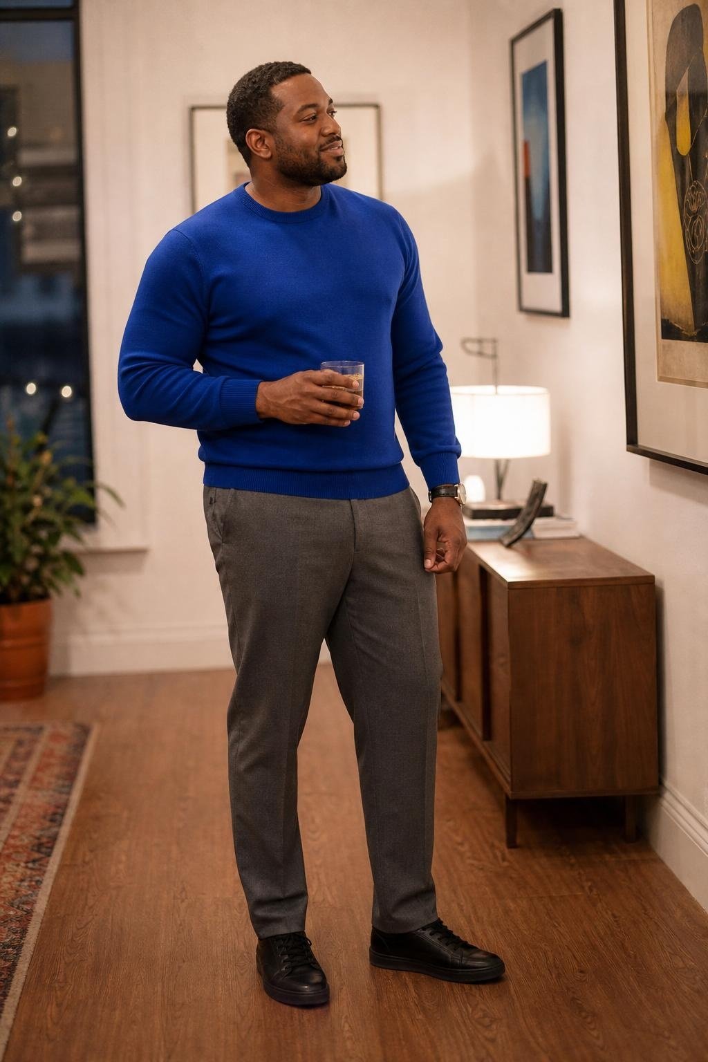 Cobalt crewneck sweater, gray wool trousers, black minimal sneakers, casual gallery opening mood (option 1)