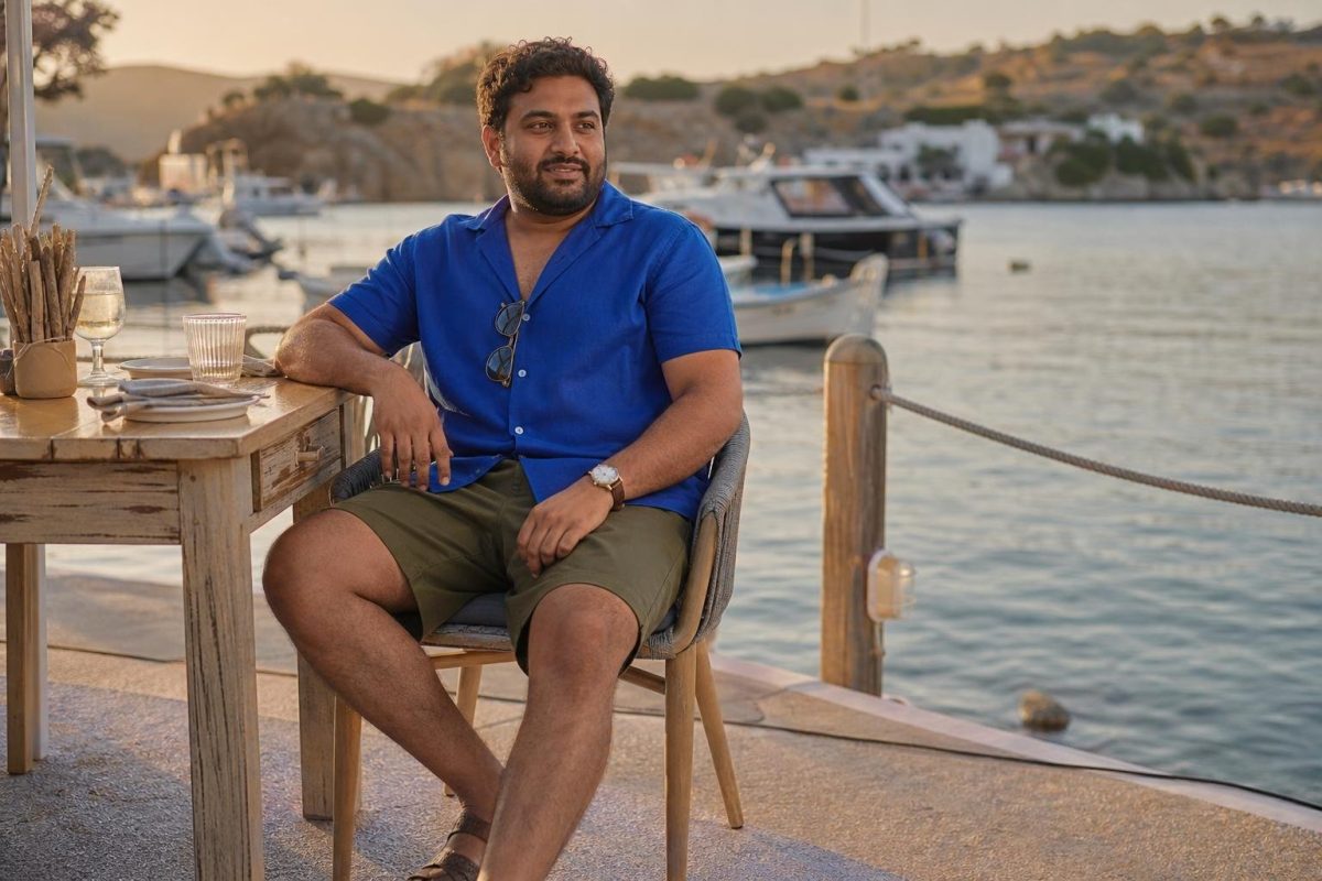 Cobalt linen shirt, olive tailored shorts, woven leather sandals, waterfront dinner with relaxed summer polish (option 1)