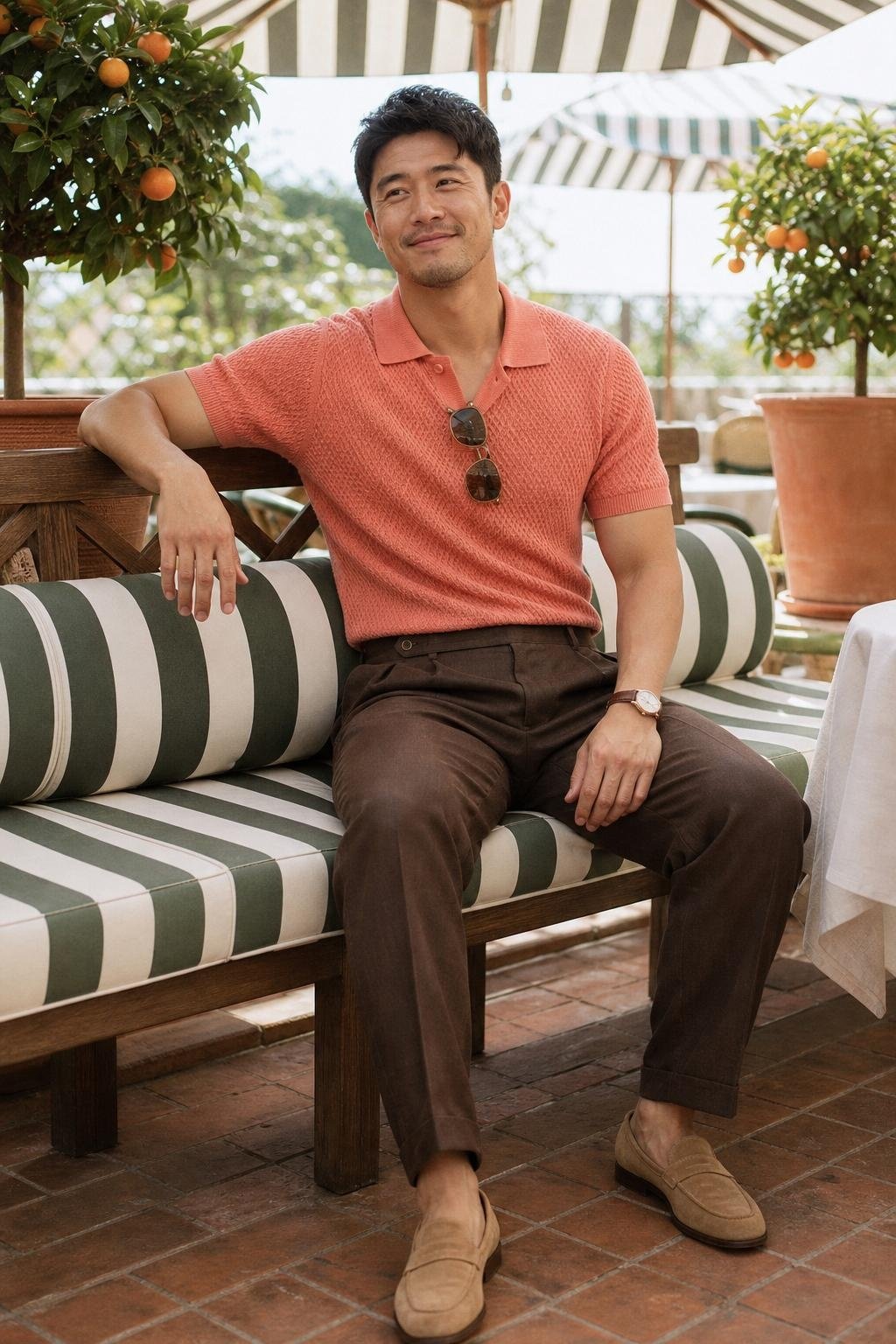 Coral knit polo, chocolate linen trousers, tan suede loafers, sunny brunch terrace (option 2)