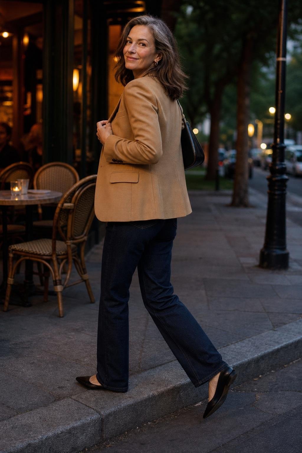 Dark straight-leg jeans, black knit top, camel blazer, pointed flats, neighborhood dinner sidewalk scene (option 1)