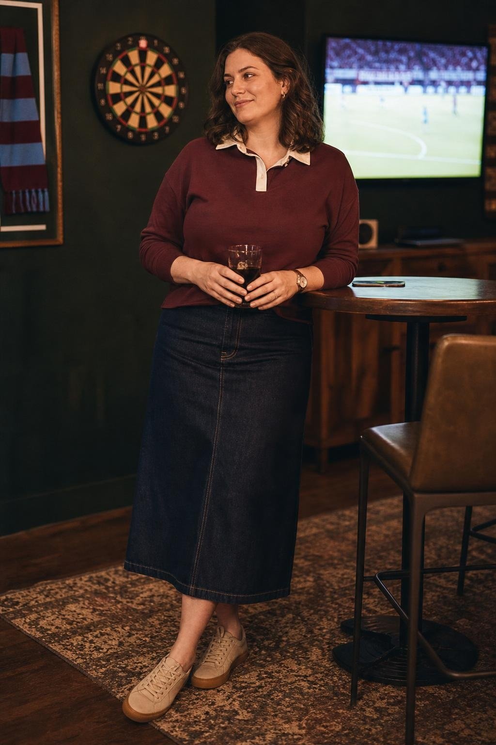 Maroon rugby shirt, dark denim midi skirt, tan sneakers, casual neighborhood pub watch party (option 2)