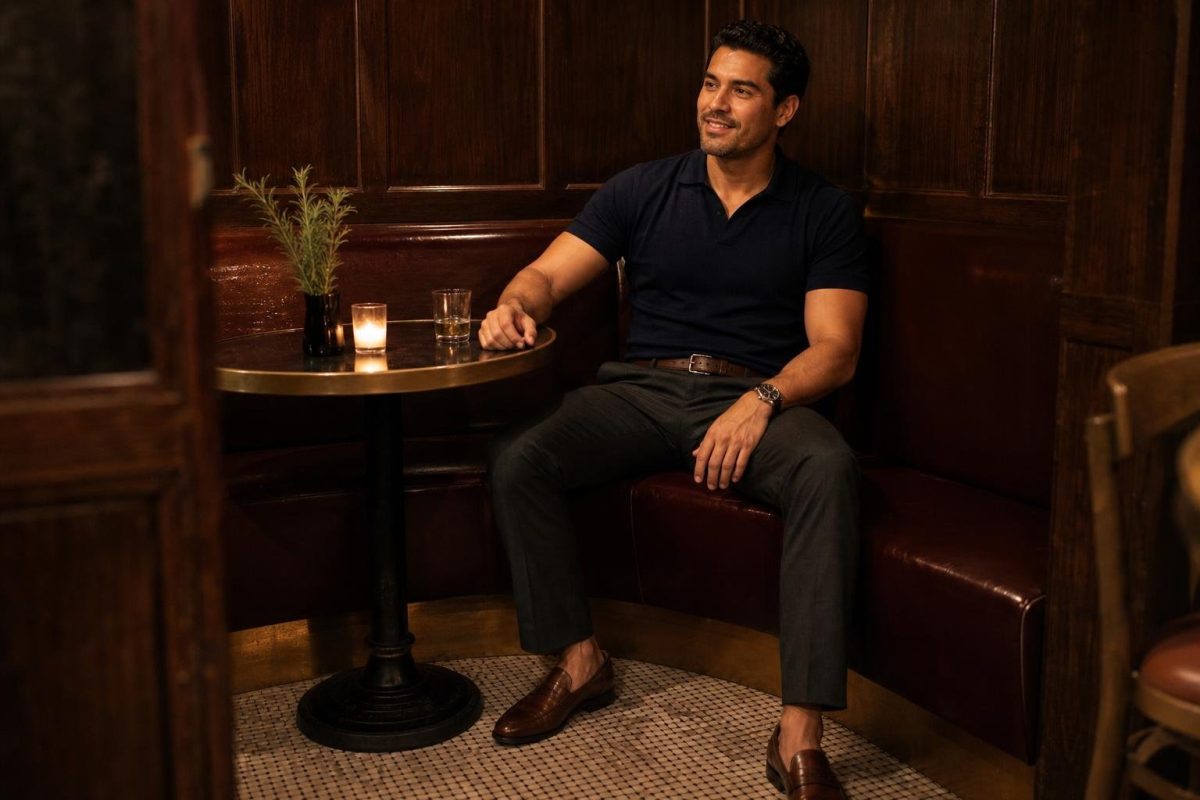 Navy knit polo, charcoal trousers, brown loafers, low-lit bistro date night with relaxed polish (option 1)