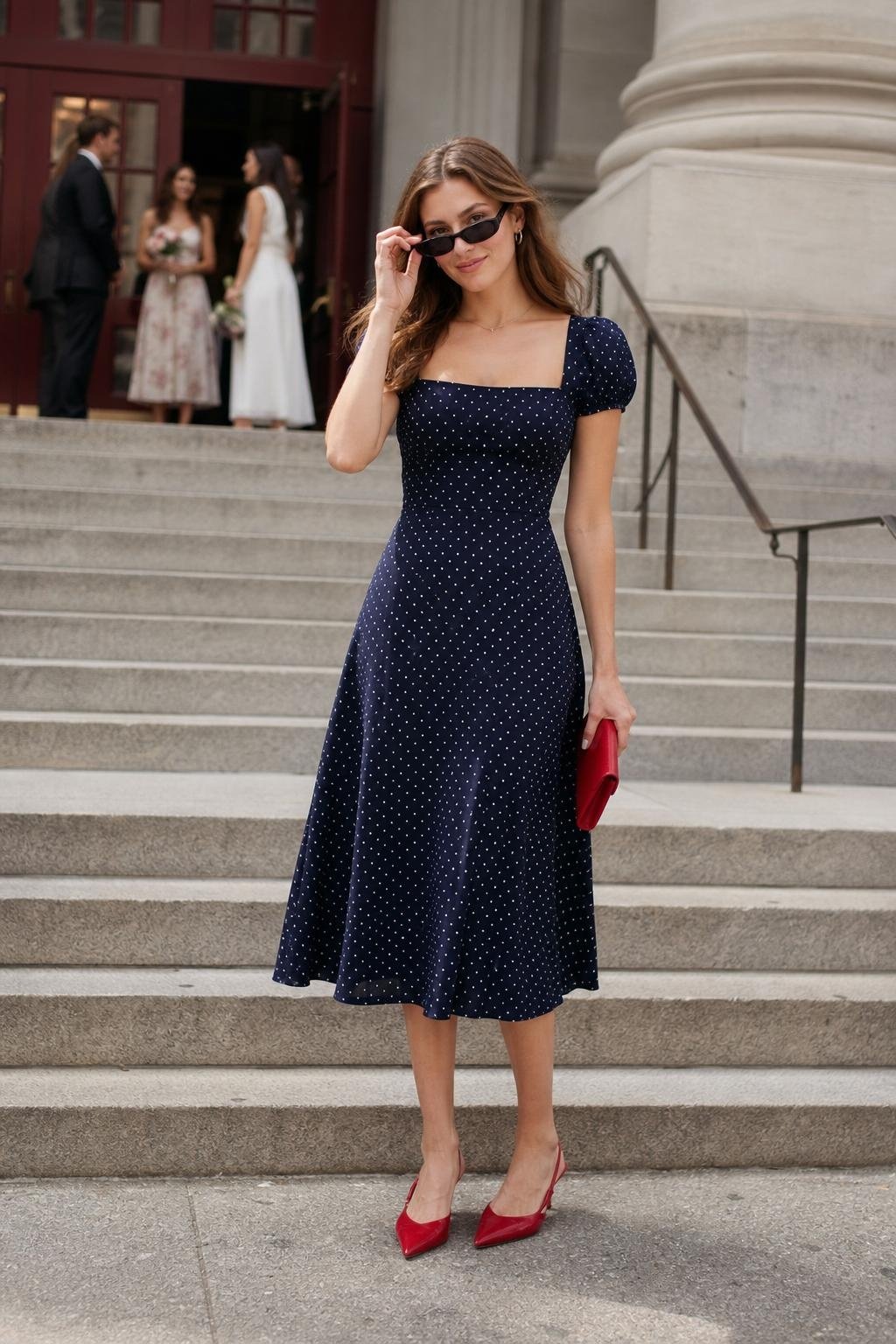 navy polka dot midi dress with red slingbacks at a classic courthouse wedding (option 2)