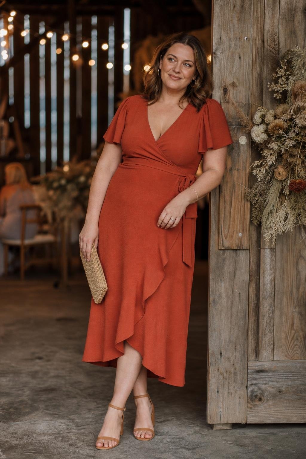 rust orange wrap midi dress with tan sandals at a rustic barn wedding (option 1)