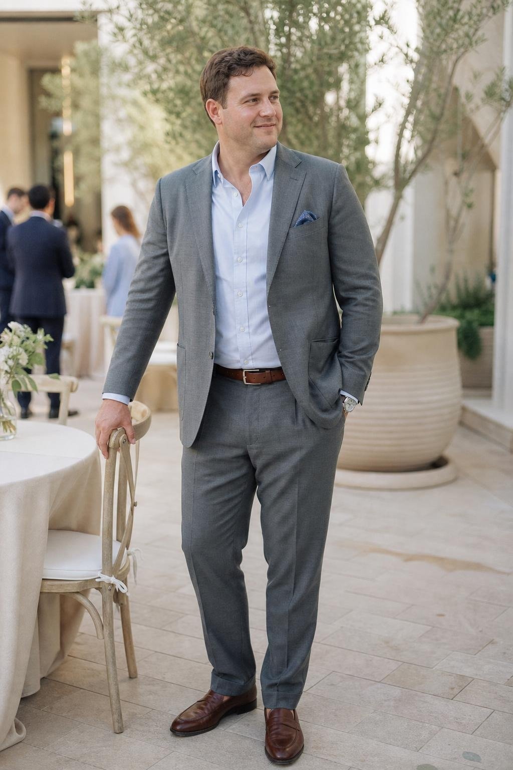 Steel gray unstructured suit separates, pale blue shirt, brown loafers, relaxed daytime wedding reception (option 1)